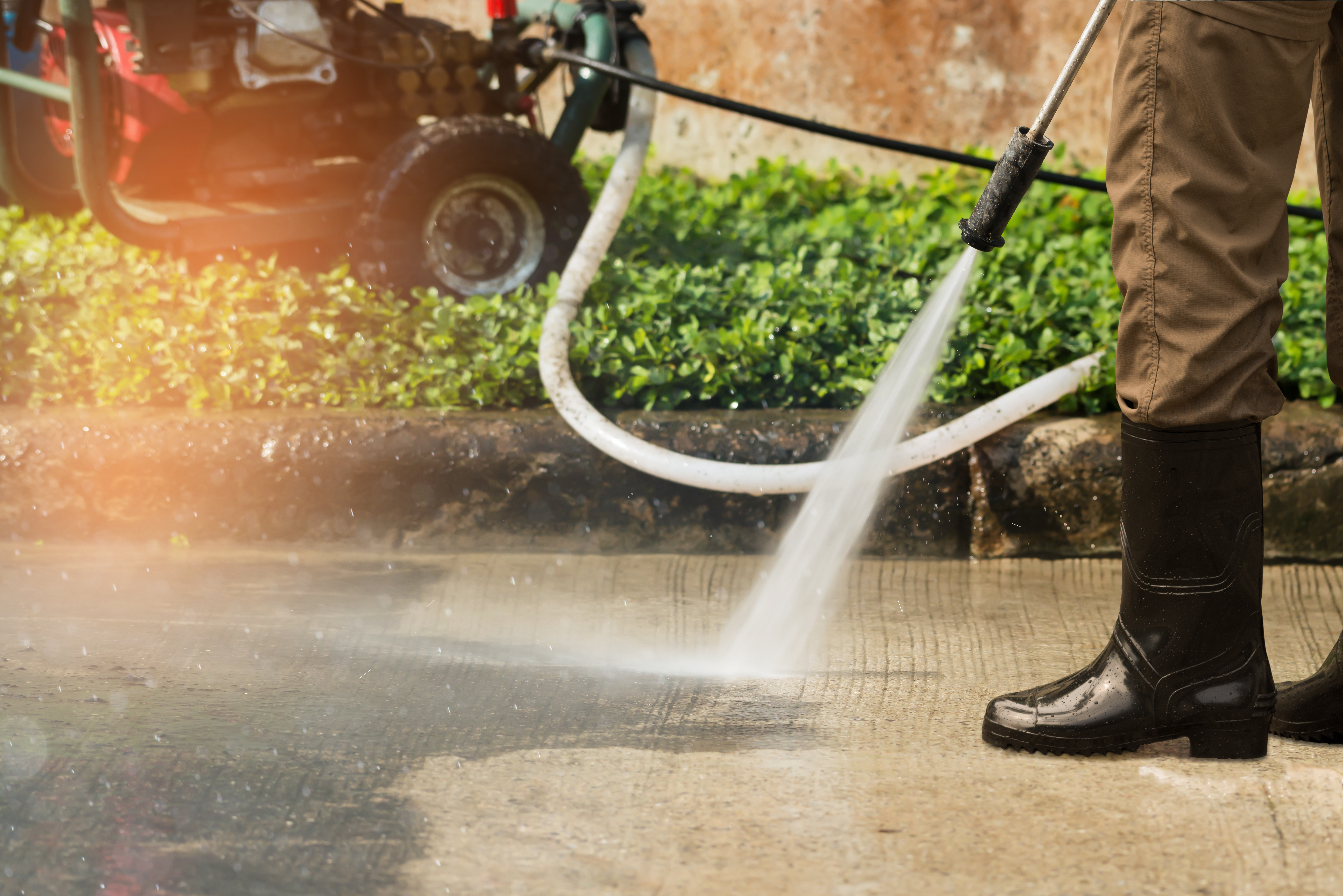 Pressure Washer Cleaning the Sidewalk